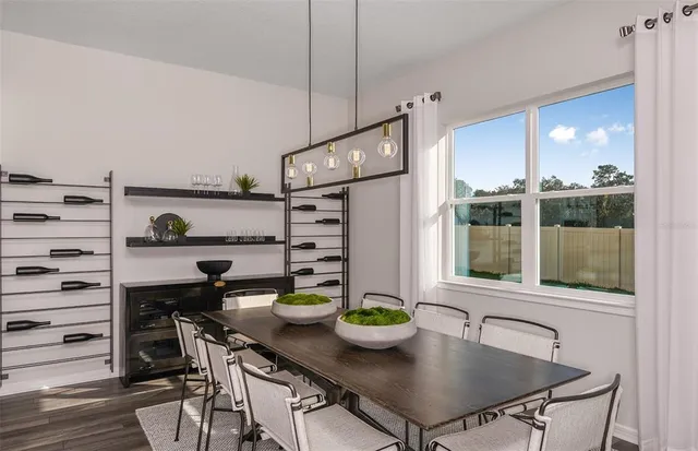 a kitchen with a table chairs and stove