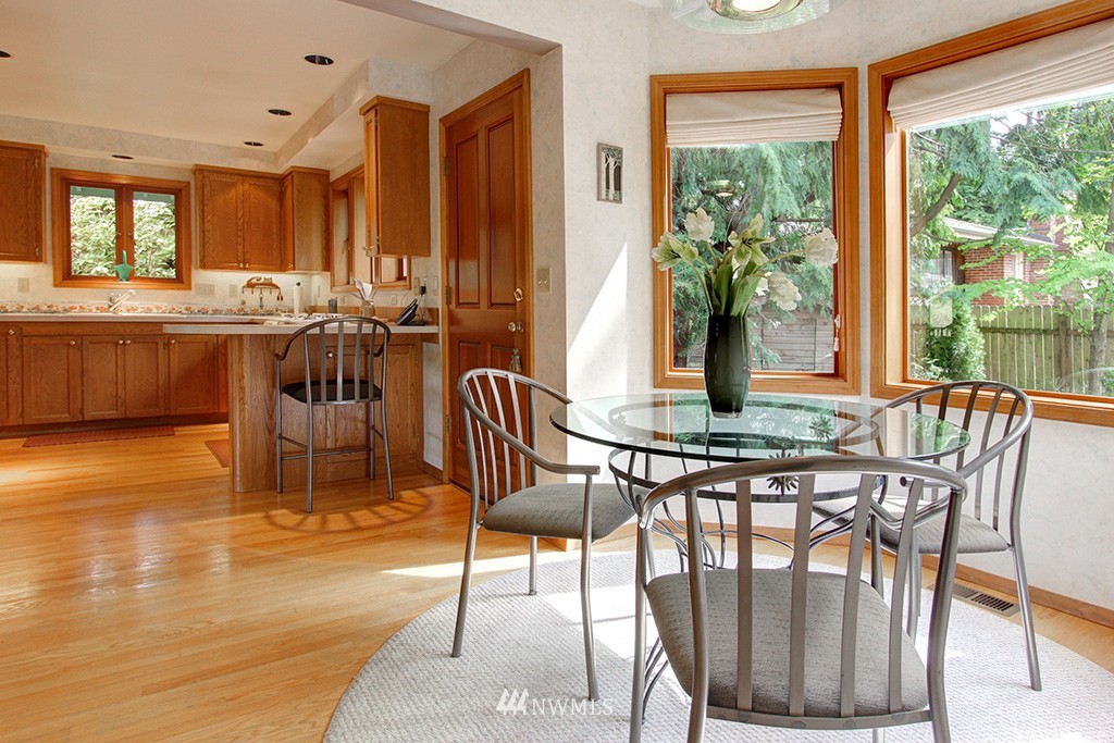 2649 Northwest 96th Street Seattle, WA 98117 - Photo 12 of 25 a view of a dining room with furniture window and wooden floor