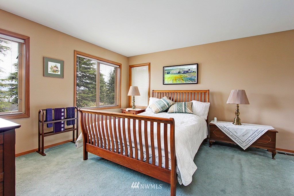 2649 Northwest 96th Street Seattle, WA 98117 - Photo 13 of 25 a bed room with furniture and a window