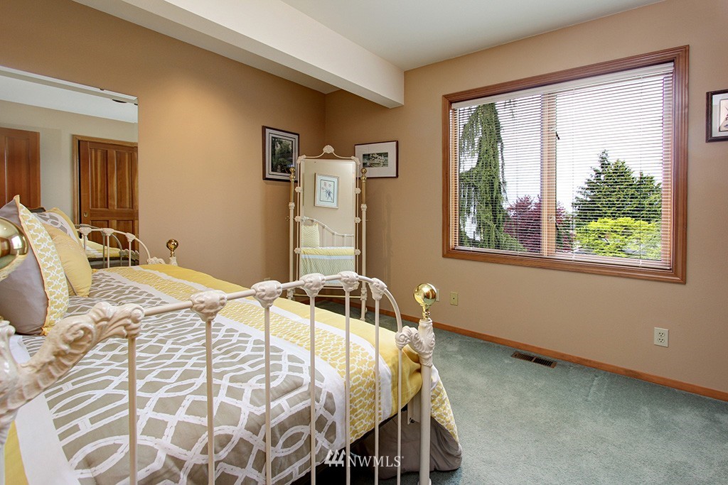 2649 Northwest 96th Street Seattle, WA 98117 - Photo 17 of 25 a bedroom with a bed and a window