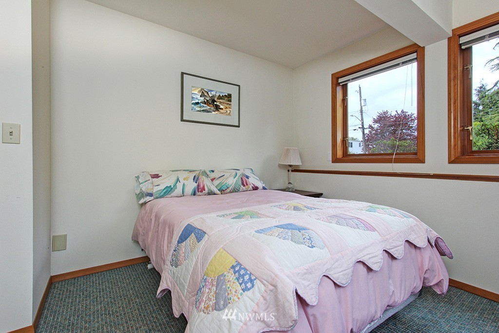 2649 Northwest 96th Street Seattle, WA 98117 - Photo 20 of 25 a bedroom with a bed and painting on the wall