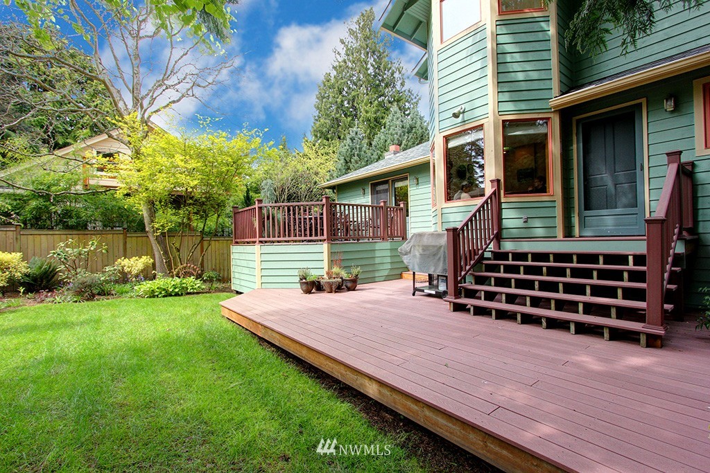 2649 Northwest 96th Street Seattle, WA 98117 - Photo 24 of 25 a backyard of a house with wooden table and chairs