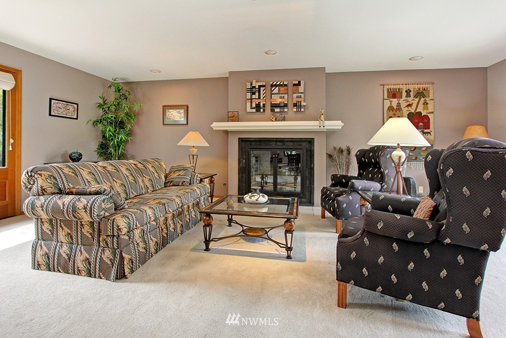 2649 Northwest 96th Street Seattle, WA 98117 - Photo 4 of 25 a living room with furniture and a fireplace