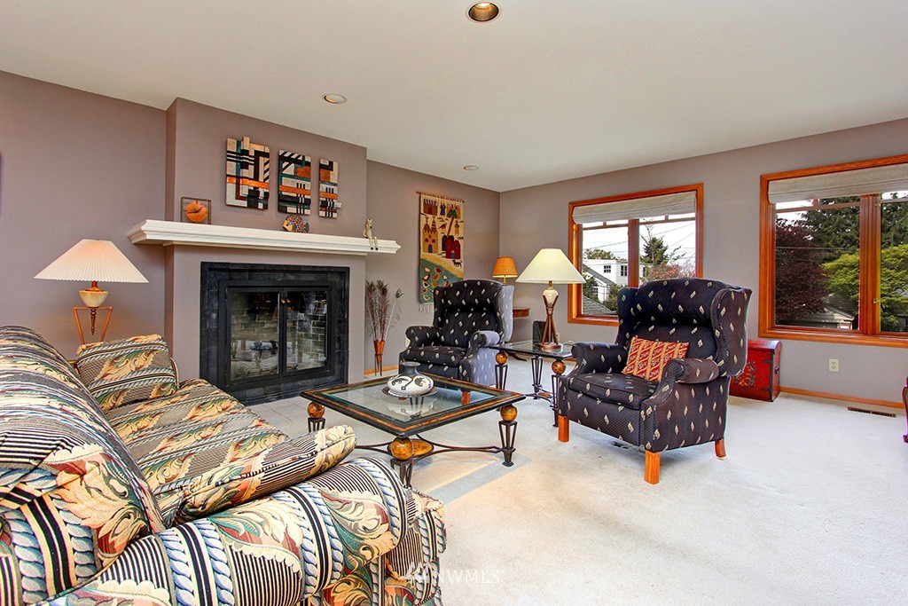 2649 Northwest 96th Street Seattle, WA 98117 - Photo 5 of 25 a living room with furniture and a fireplace