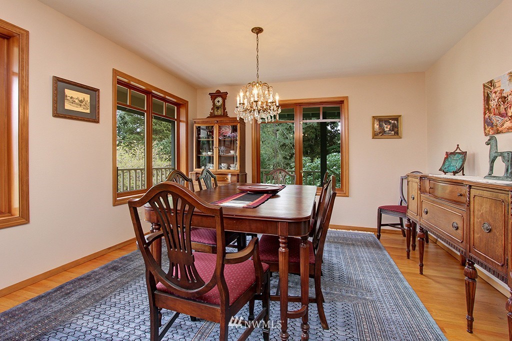 2649 Northwest 96th Street Seattle, WA 98117 - Photo 7 of 25 a view of a dining room with furniture window and wooden floor