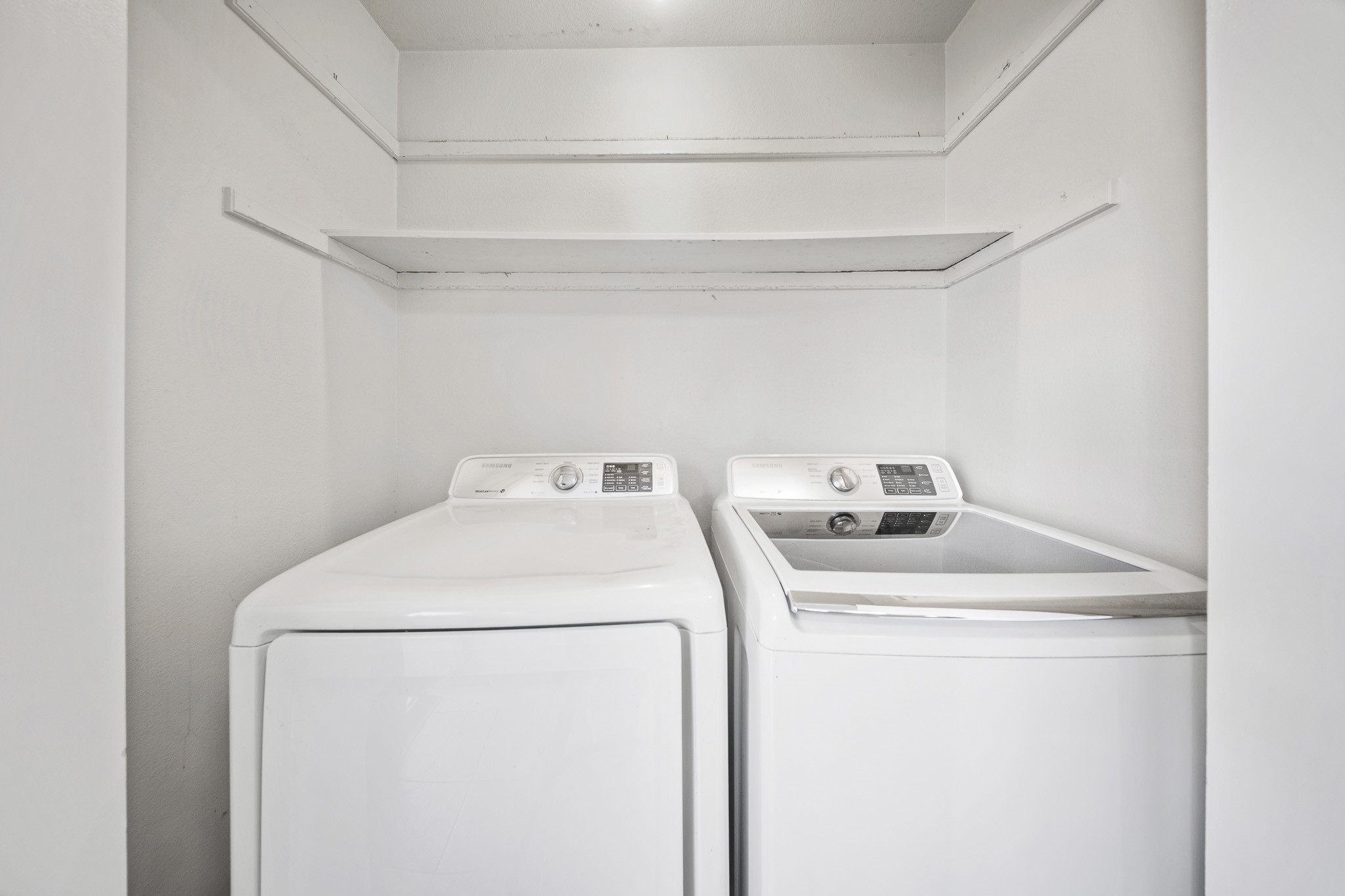 5814 Langfield Road, Unit 5814 Houston, TX 77092 - Photo 12 of 35 a utility room with dryer and washer