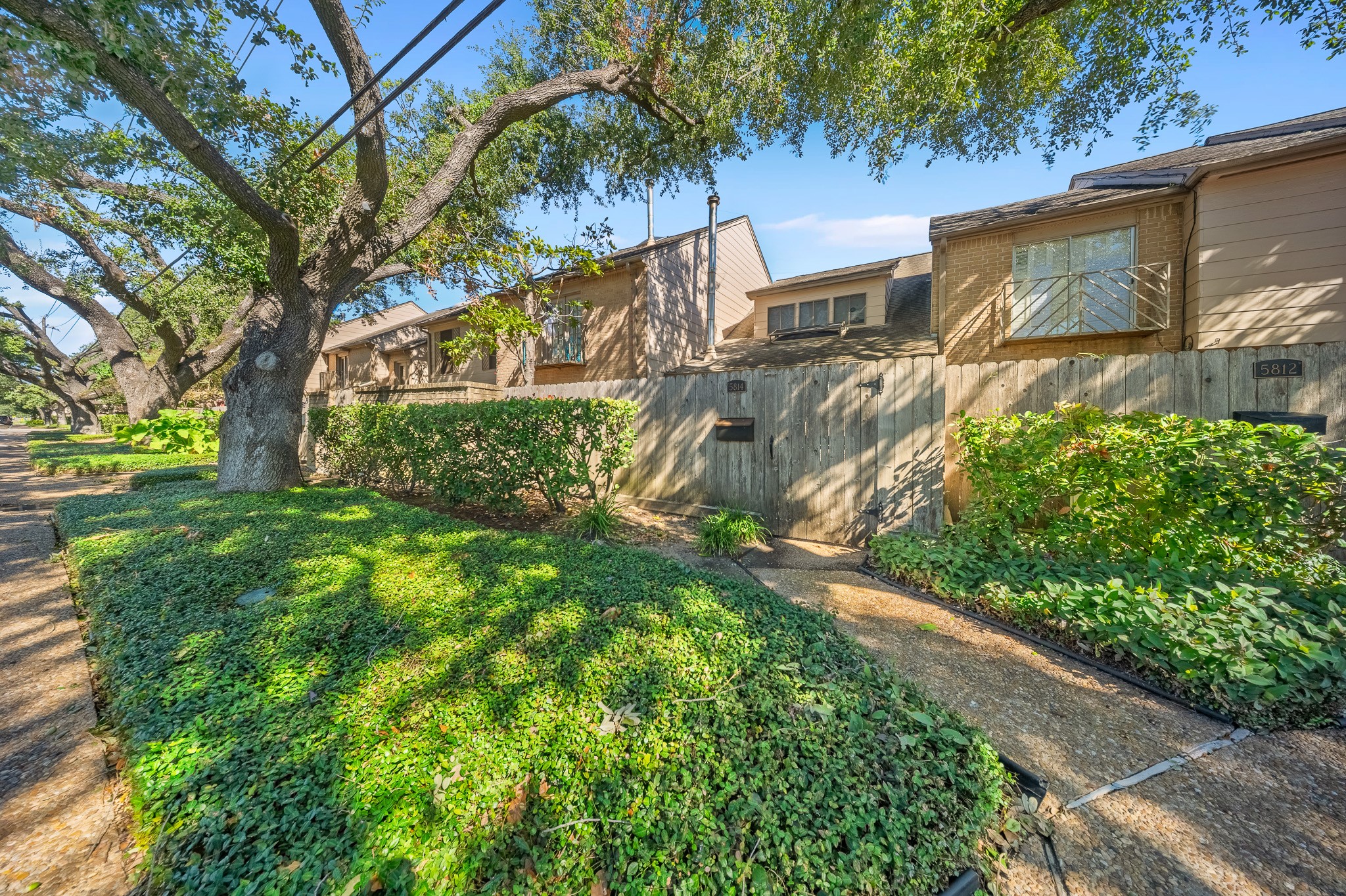 5814 Langfield Road, Unit 5814 Houston, TX 77092 - Photo 2 of 35 a view of backyard with tree