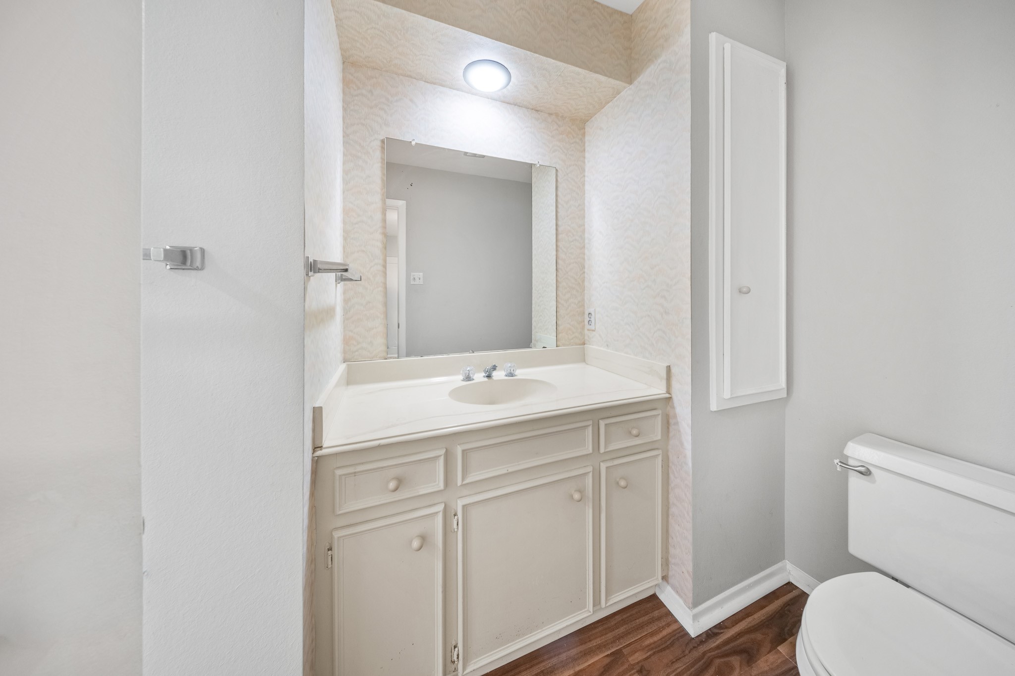 5814 Langfield Road, Unit 5814 Houston, TX 77092 - Photo 23 of 35 a bathroom with a sink toilet and mirror