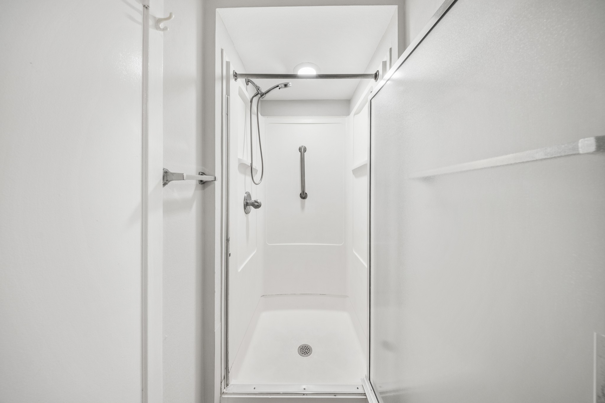 5814 Langfield Road, Unit 5814 Houston, TX 77092 - Photo 24 of 35 a bathroom with a glass shower door