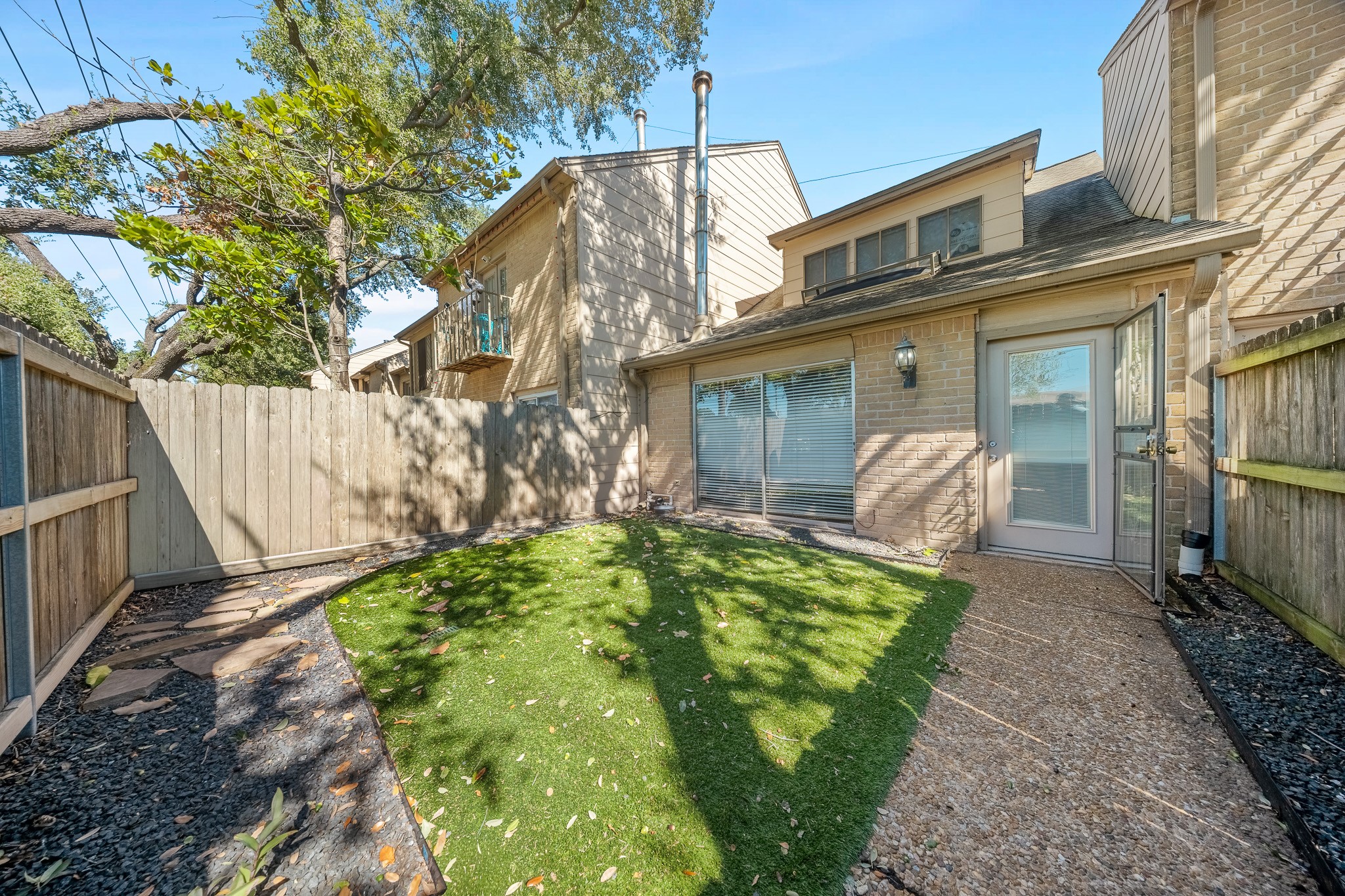 5814 Langfield Road, Unit 5814 Houston, TX 77092 - Photo 3 of 35 a front view of a house with garden