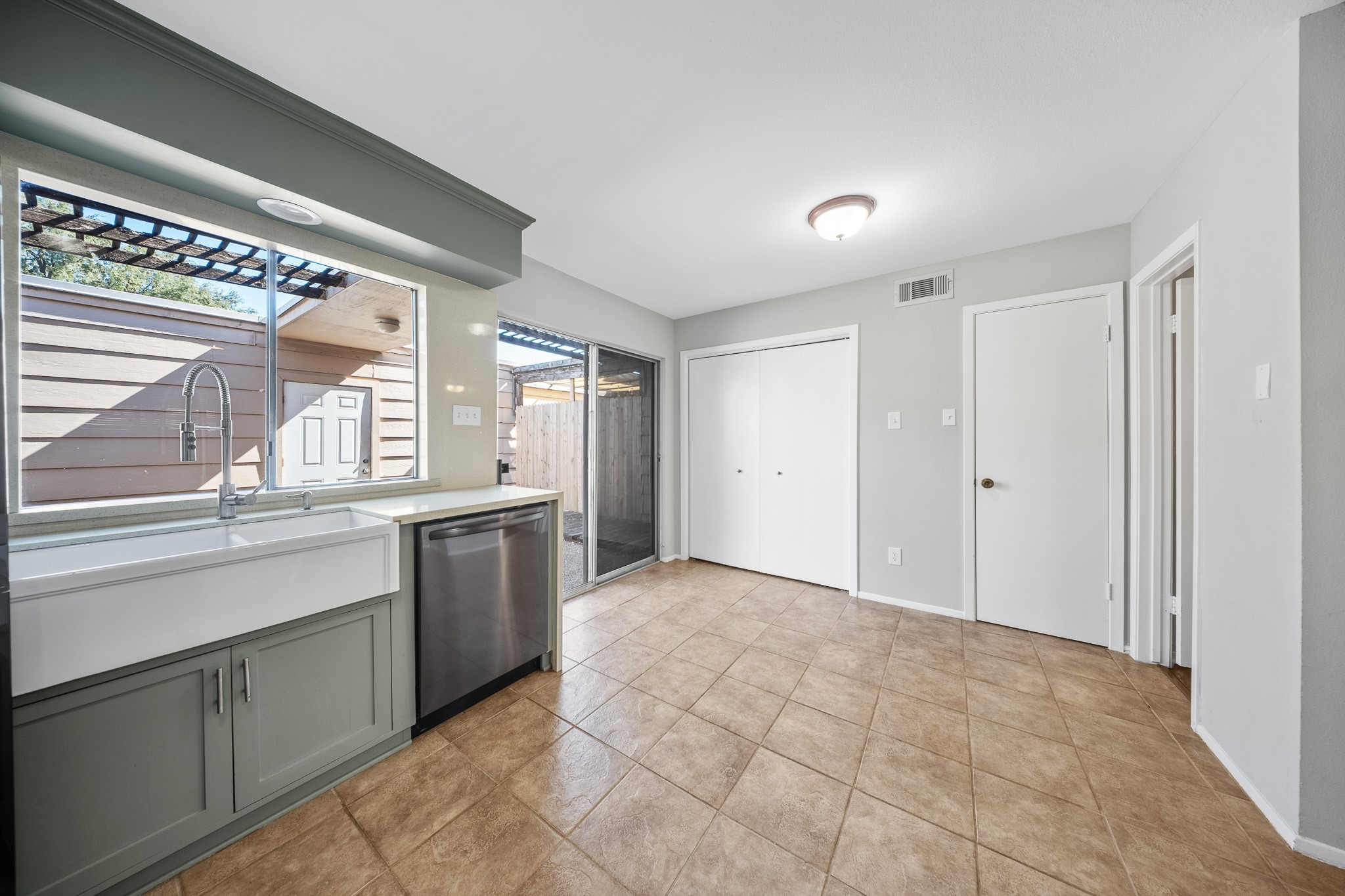 5814 Langfield Road, Unit 5814 Houston, TX 77092 - Photo 10 of 35 a view of a kitchen with a sink and windows