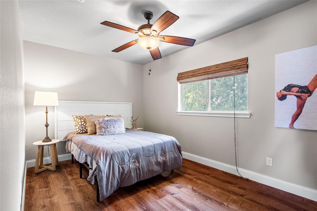 1901 Yellowstone Lane Corinth, TX 76210 - Photo 32 of 32 Bedroom featuring wood finished floors and ceiling fan
