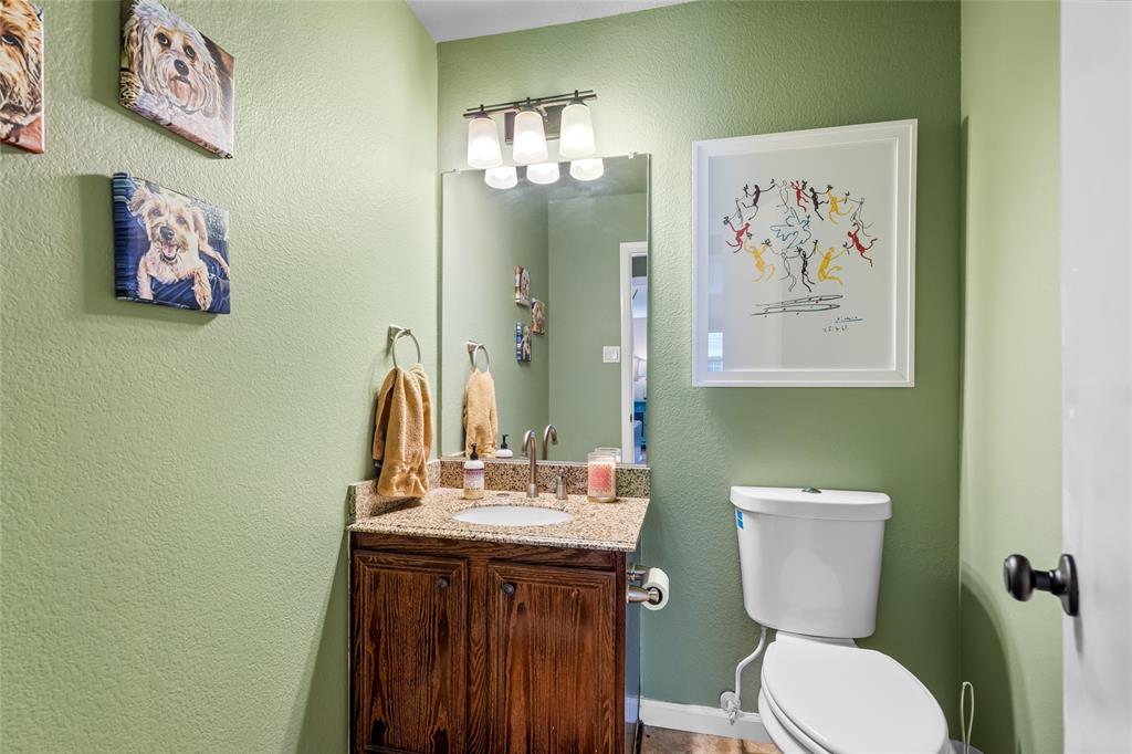 1901 Yellowstone Lane Corinth, TX 76210 - Photo 4 of 32 Bathroom featuring a textured wall and vanity
