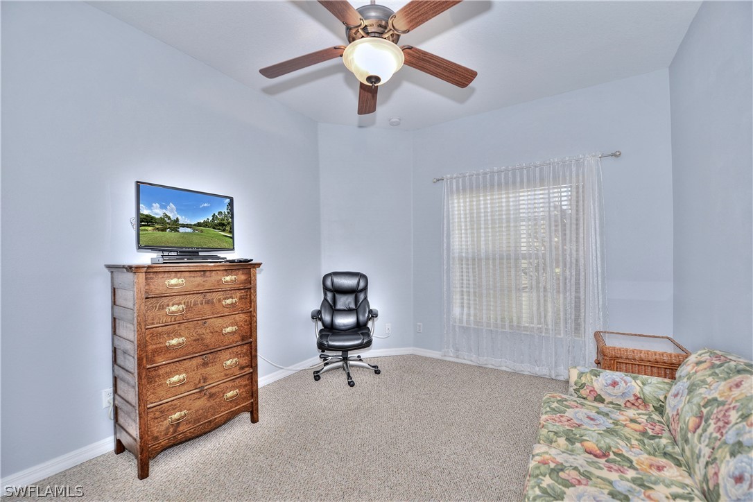 3600 Rue Alec Loop, Unit 5 North Fort Myers, FL 33917 - Photo 14 of 16 a bedroom with furniture and a window