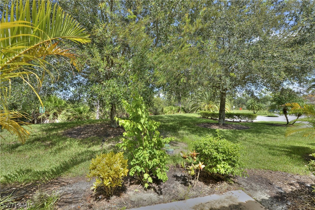 3600 Rue Alec Loop, Unit 5 North Fort Myers, FL 33917 - Photo 16 of 16 a view of a garden with trees