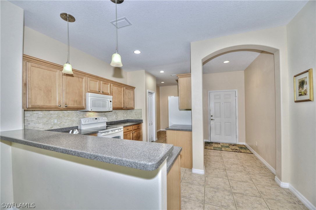 3600 Rue Alec Loop, Unit 5 North Fort Myers, FL 33917 - Photo 8 of 16 a bathroom with a granite countertop sink a mirror and shower