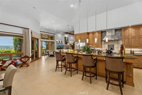 a kitchen with a refrigerator and a sink