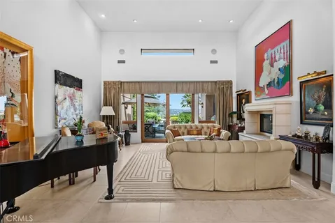 a living room with furniture fireplace and flat screen tv