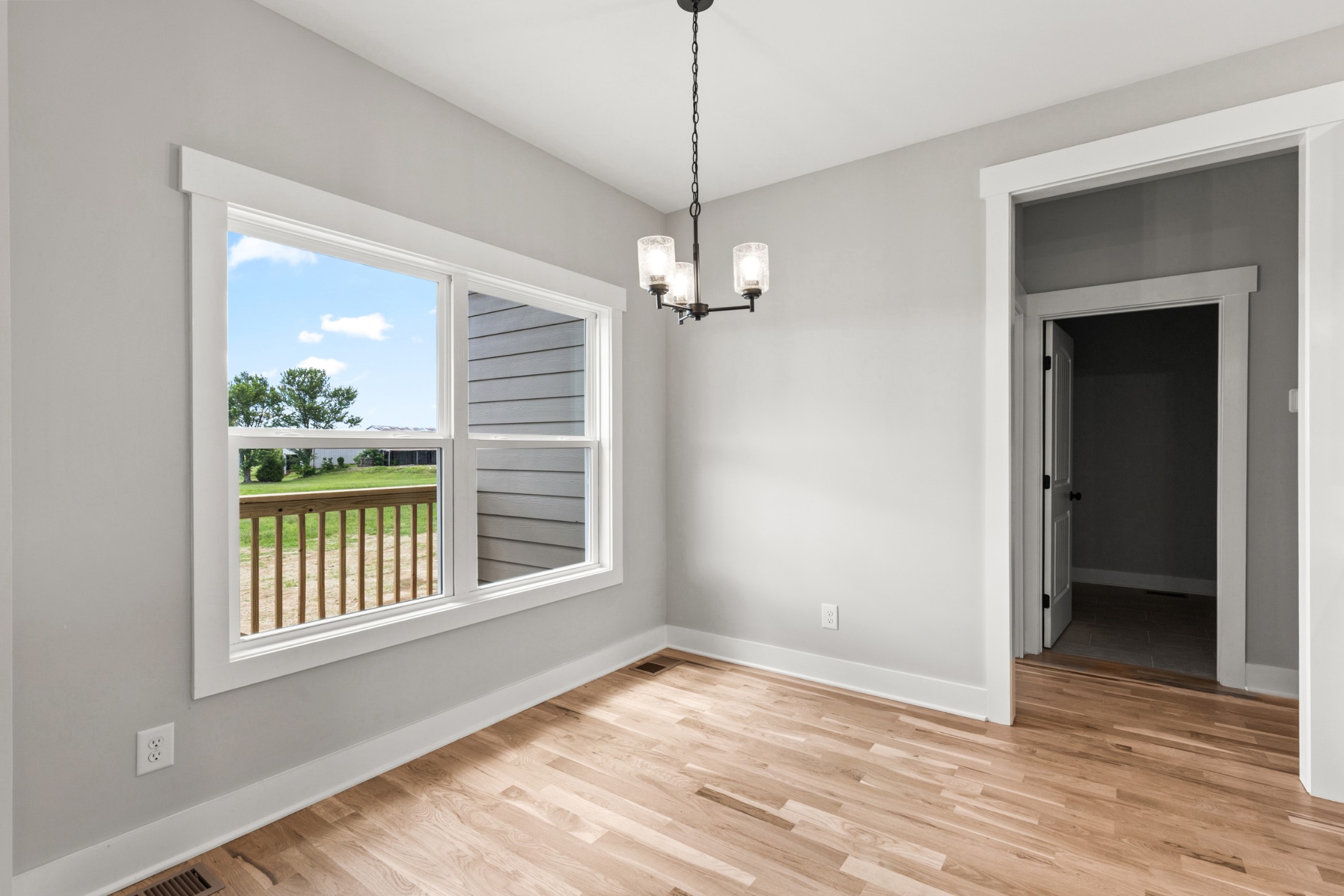 5638 Borthick Road Springfield, TN 37172 - Photo 12 of 43 a view of an empty room with wooden floor and a window