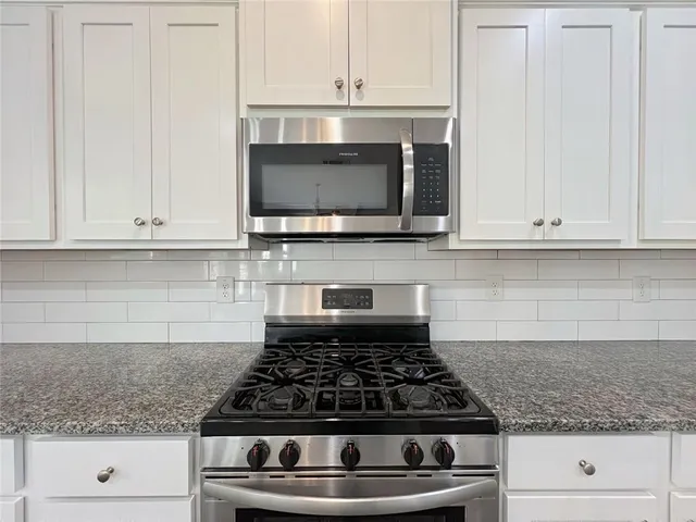 an empty room with a empty space and a window