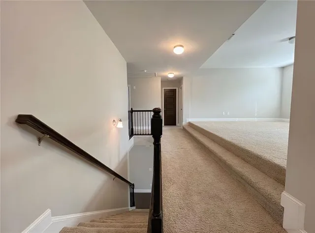 a view of a livingroom with a ceiling fan and window