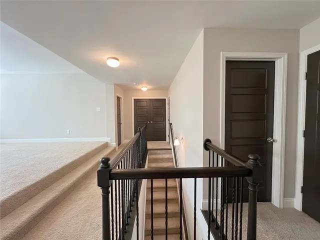 a big room with closet and a ceiling fan