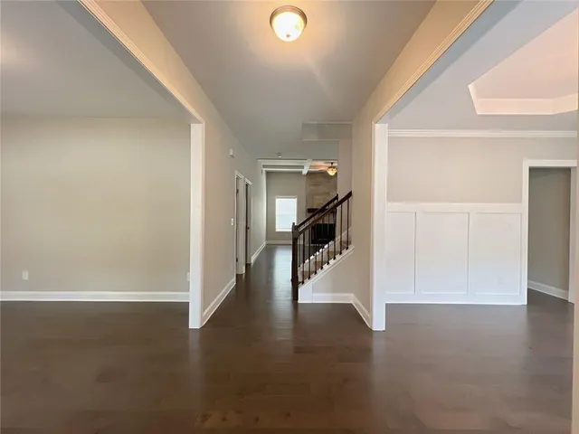 a view of gallery with wooden floor