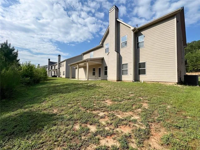 a view of a wrought iron fences with swimming pool in front of it