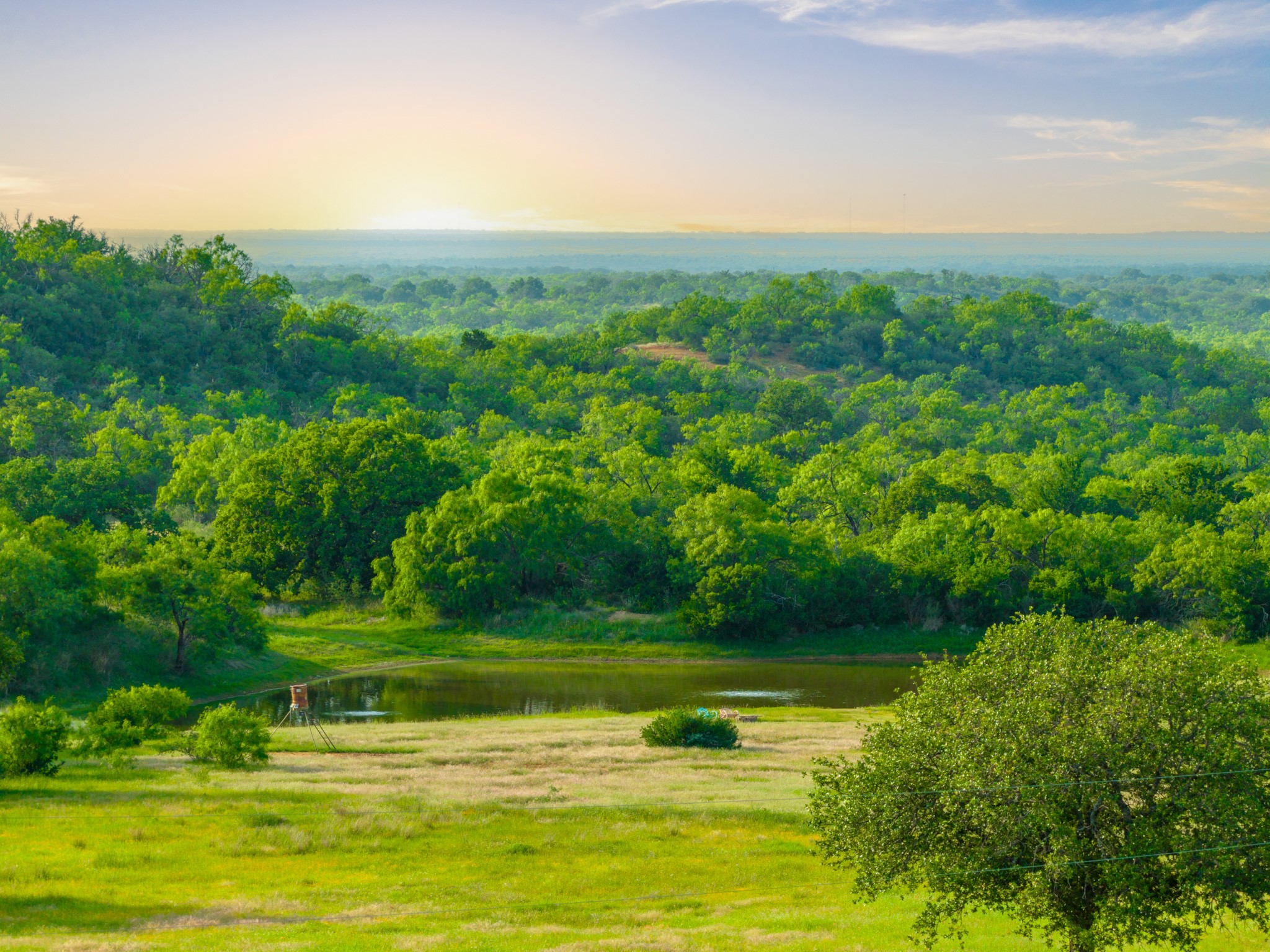 11079 Cr 266 Rochelle Tx 76872 Rochelle, TX 76872 - Photo 28 of 40 Expansive green landscape featuring rolling hills and a visible body of water
