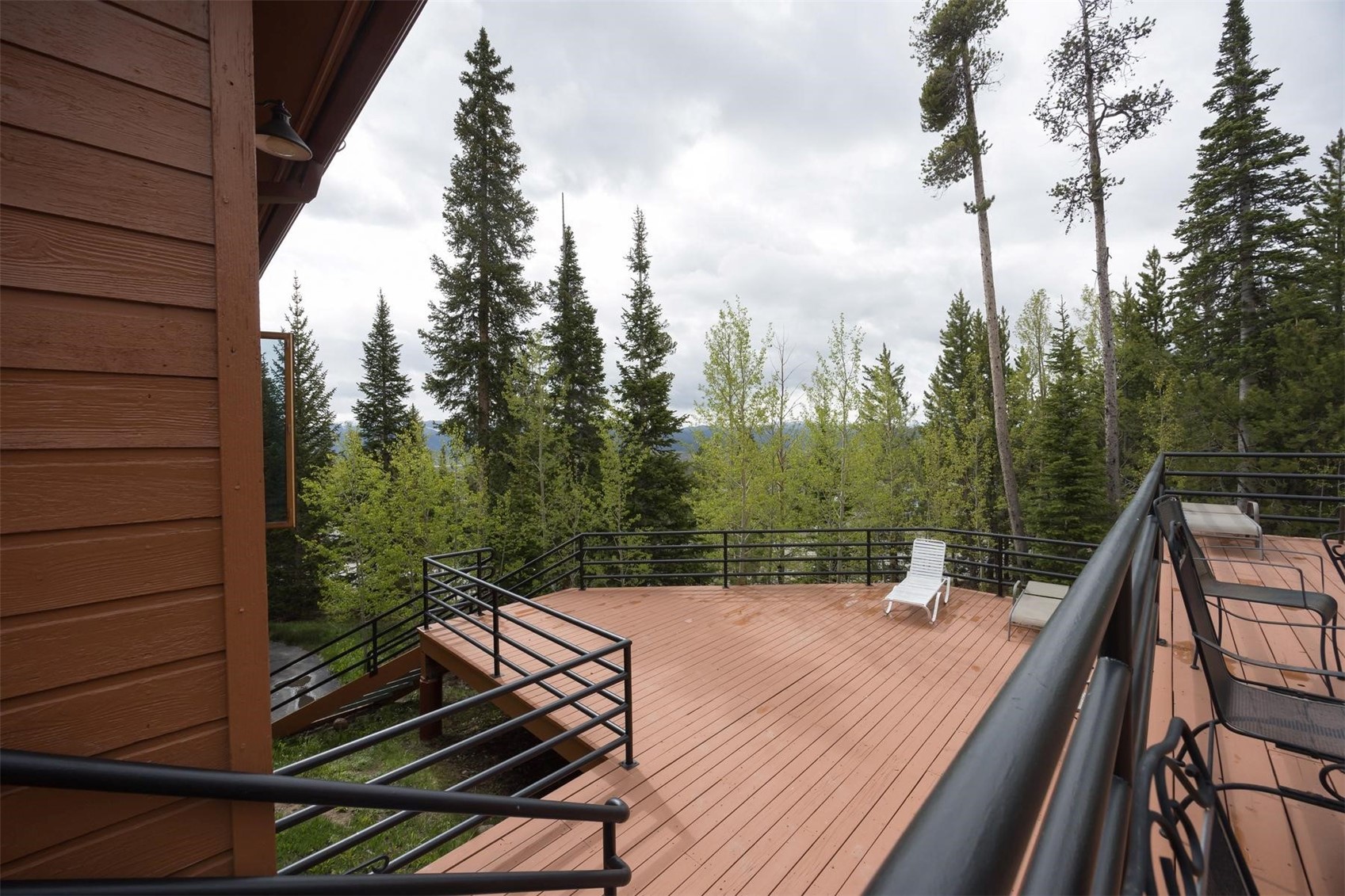 91100 Ryan Gulch Road, Unit 91105 Silverthorne, CO 80498 - Photo 41 of 49 a view of a balcony with wooden floor and outdoor space