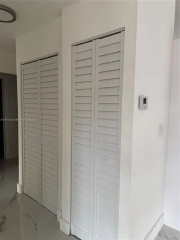 an empty room with a wooden door