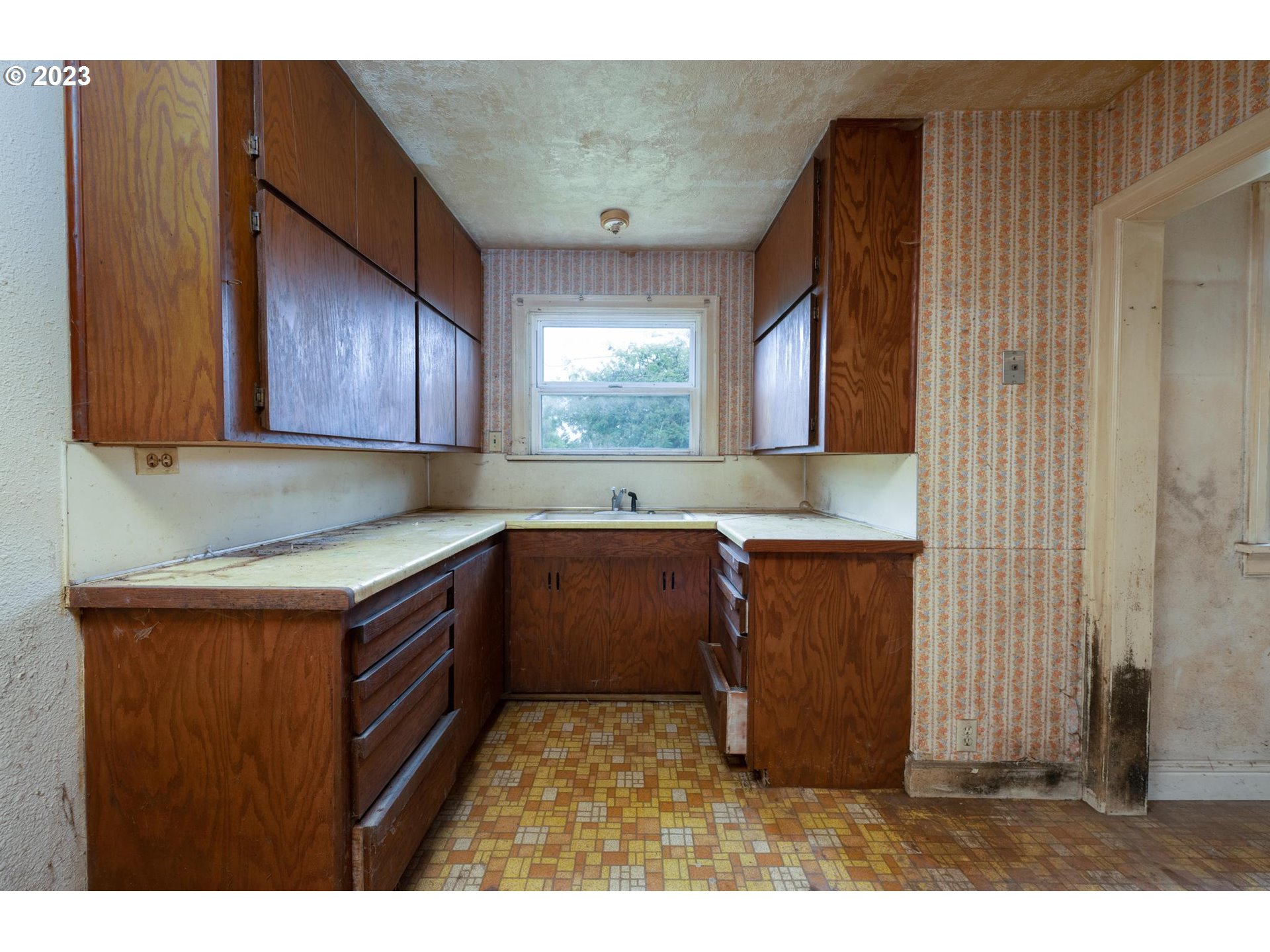 92182 Front Road Astoria, OR 97103 - Photo 7 of 21 a kitchen with a sink cabinets and wooden floor