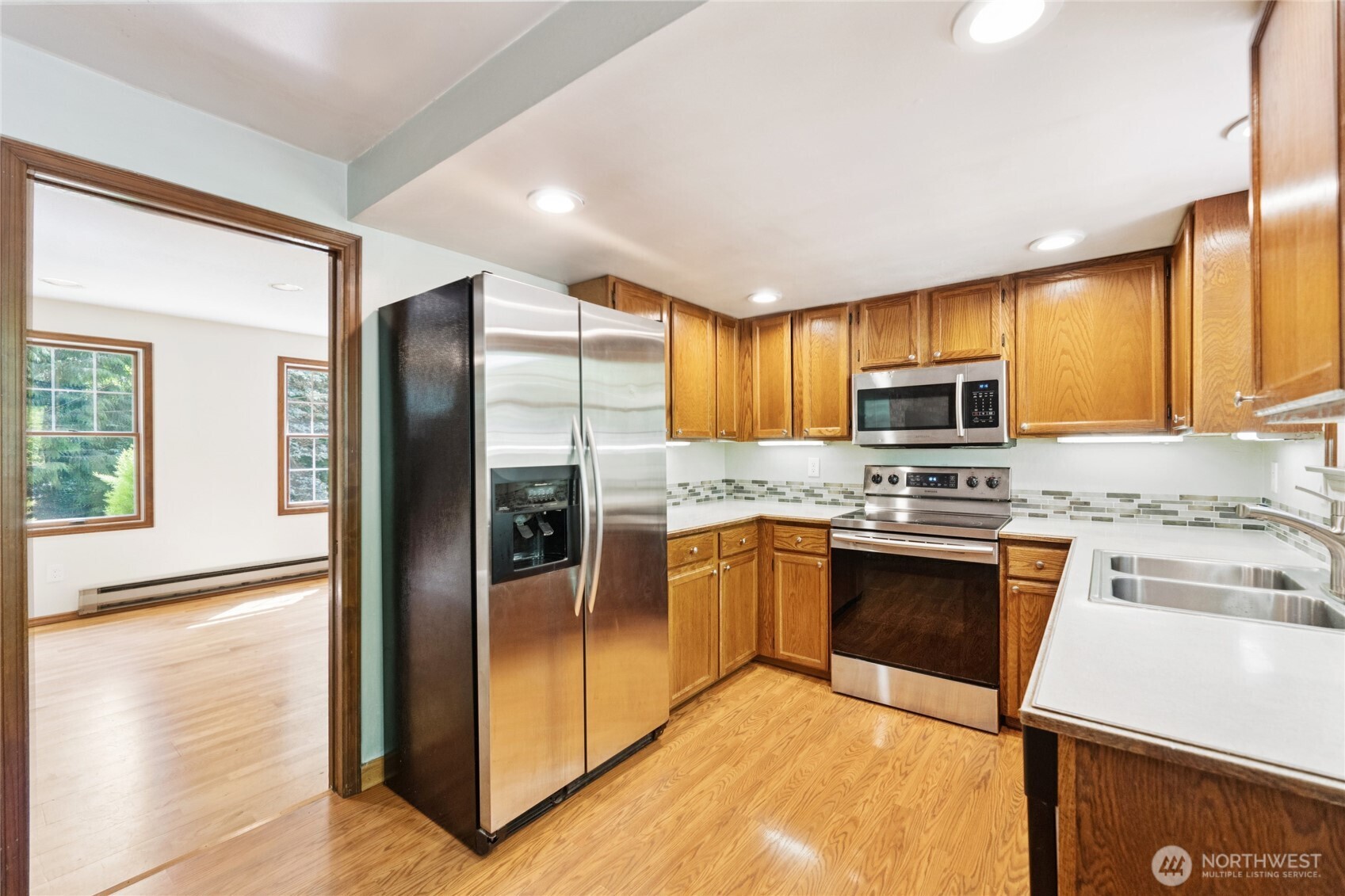 2216 Newberg Road Snohomish, WA 98290 - Photo 12 of 32 a kitchen with stainless steel appliances granite countertop a refrigerator and a stove top oven
