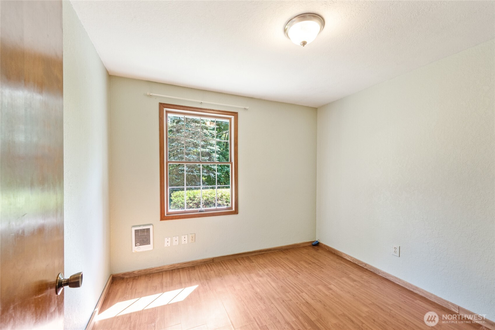 2216 Newberg Road Snohomish, WA 98290 - Photo 15 of 32 an empty room with wooden floor and windows