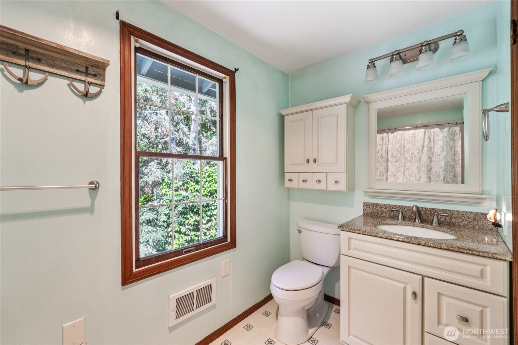 2216 Newberg Road Snohomish, WA 98290 - Photo 25 of 32 a bathroom with a granite countertop sink mirror vanity and a toilet