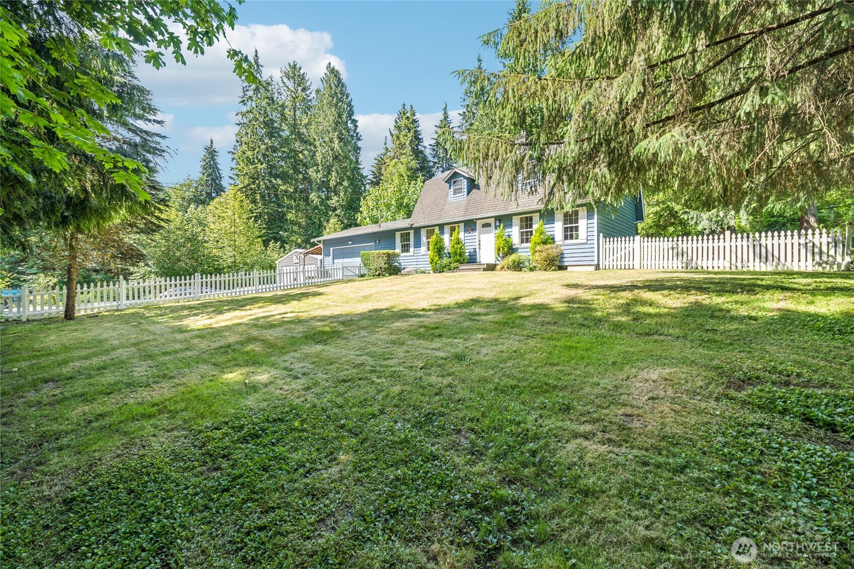 2216 Newberg Road Snohomish, WA 98290 - Photo 30 of 32 a view of an house with backyard and a tree