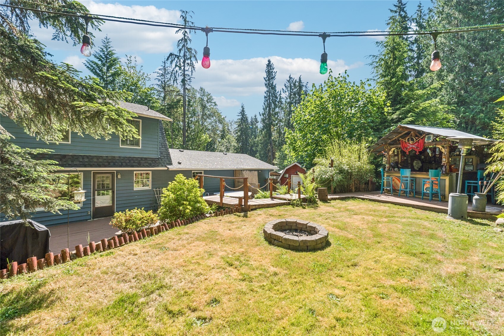 2216 Newberg Road Snohomish, WA 98290 - Photo 31 of 32 a view of a house with swimming pool and porch
