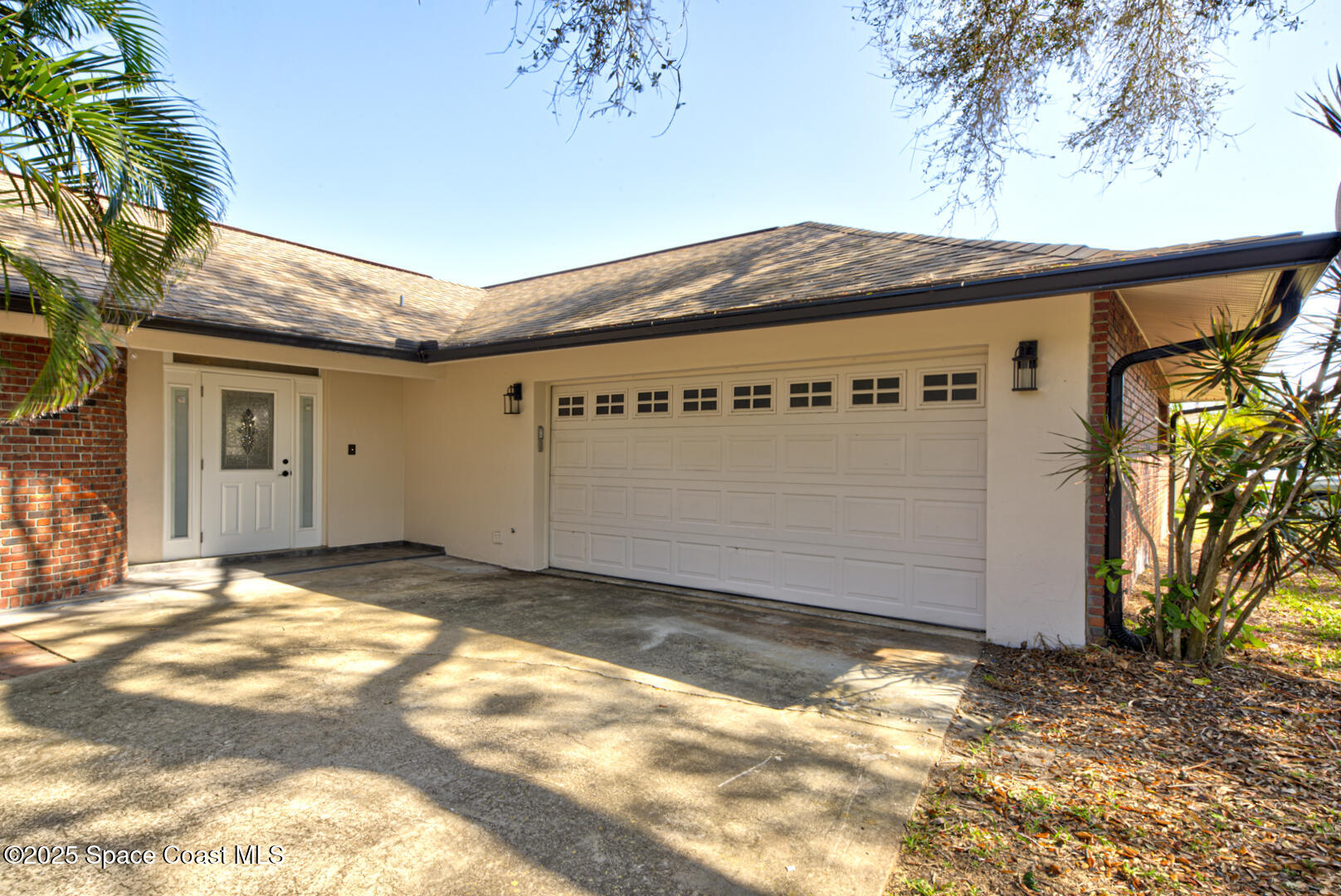 1240 St George Road Merritt Island, FL 32952 - Photo 2 of 46 front door & garage