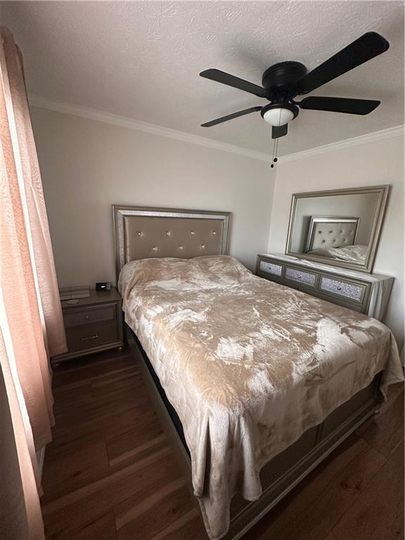 1625 Conley Road, Unit 143 Conley, GA 30288 - Photo 4 of 6 a bedroom with a bed and a ceiling fan