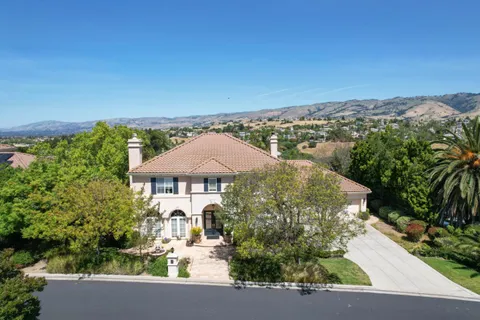 an aerial view of a house with a garden
