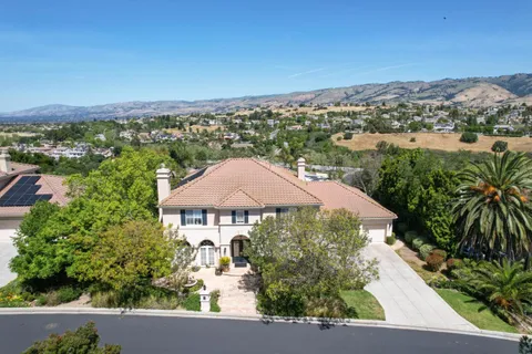 an aerial view of a house with a garden