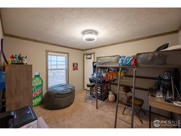 a living room with furniture a rug and a flat screen tv