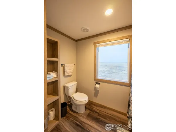a room with furniture and a book shelf
