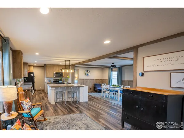 a kitchen with stainless steel appliances granite countertop a sink a stove and cabinets