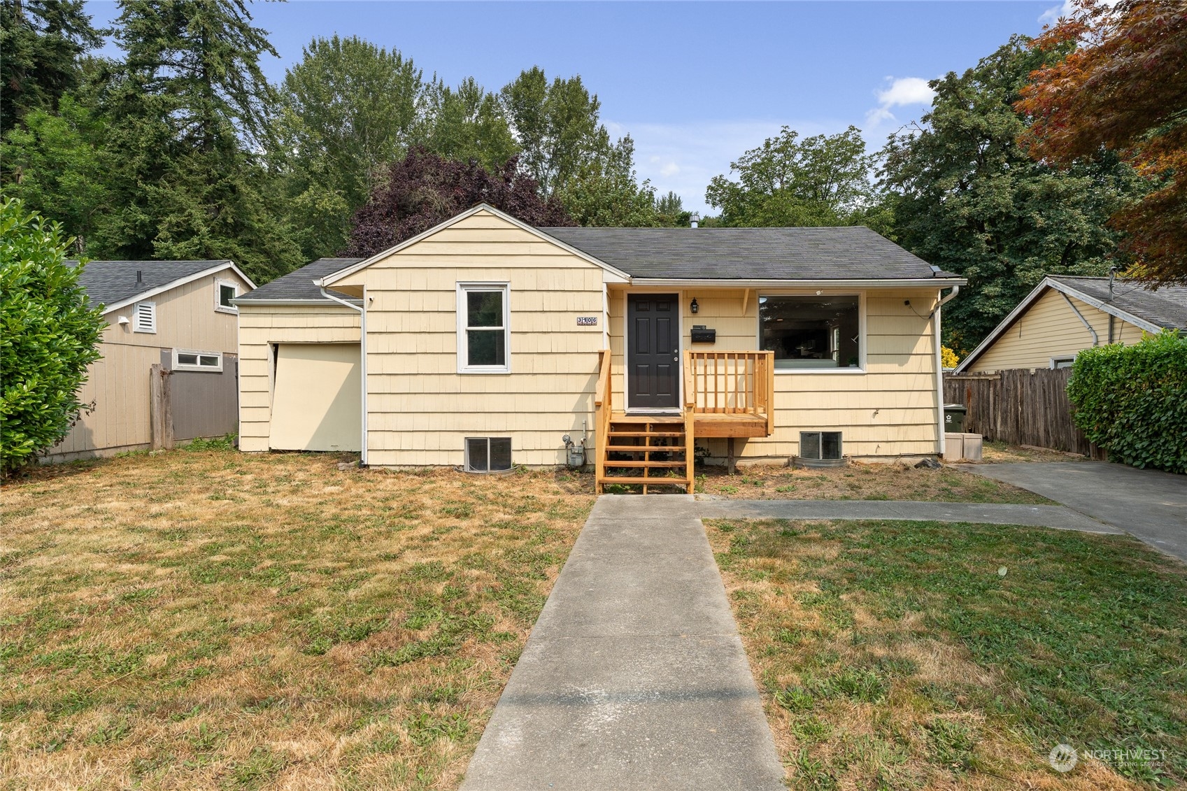 3106 Southeast 5th Street Renton, WA 98058 - Photo 1 of 21 a front view of a house with yard