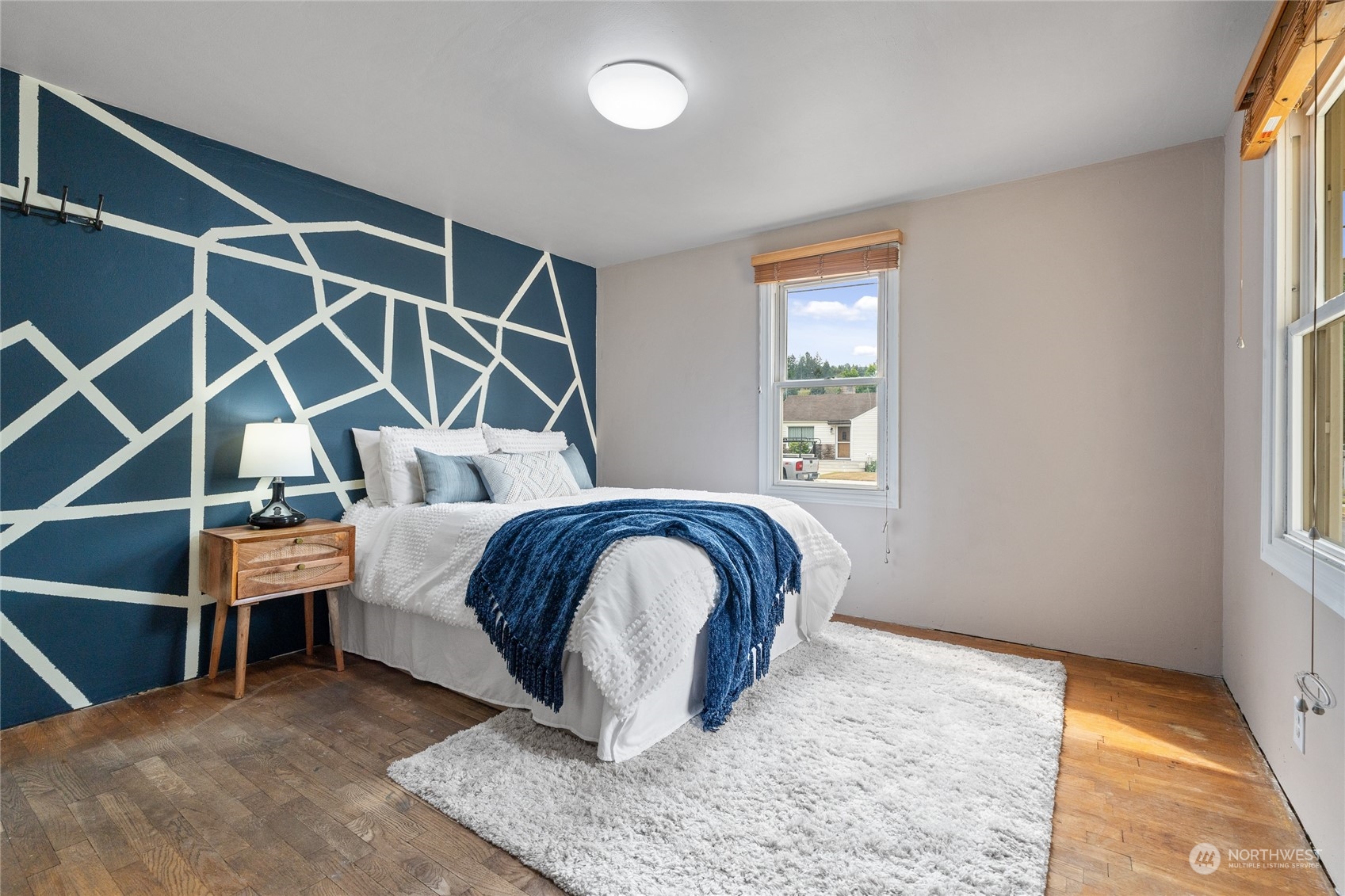 3106 Southeast 5th Street Renton, WA 98058 - Photo 9 of 21 a bedroom with a bed and a window
