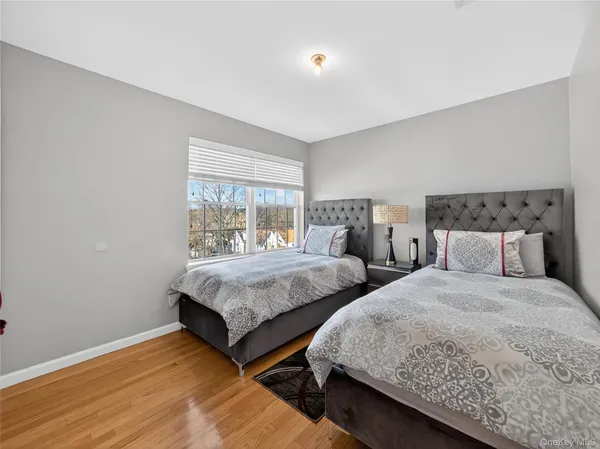 a bedroom with bed and a window