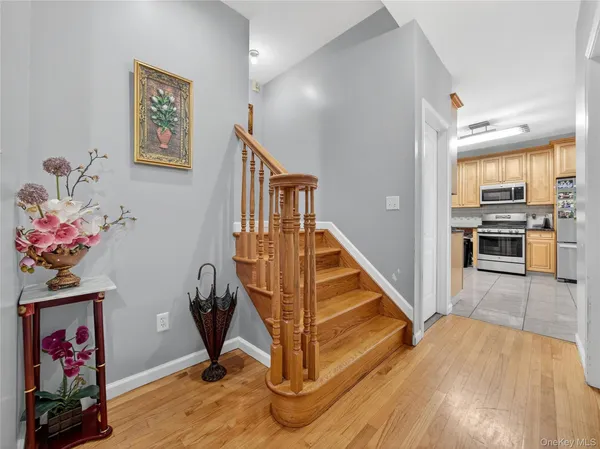 a view of entryway with wooden floor