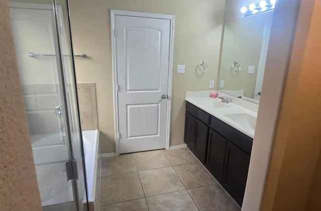 a kitchen with granite countertop a stove a sink and a counter space