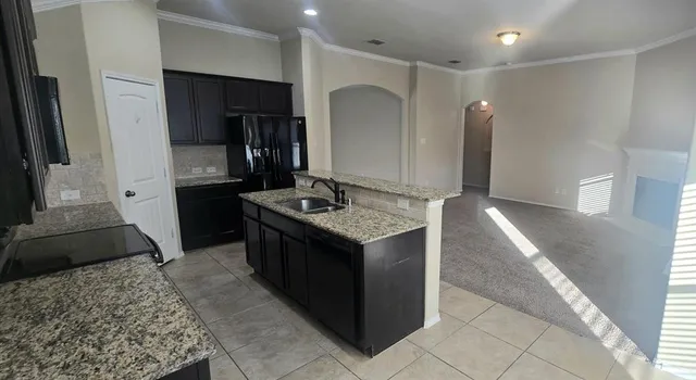 a bathroom with a double vanity sink and mirror